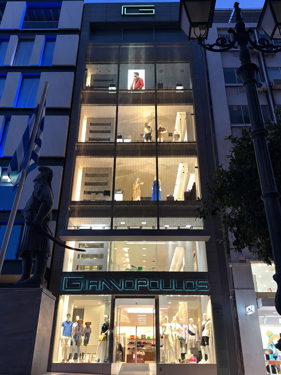 The illuminated multi-storey façade of the GIANNOPOULOS store in Piraeus